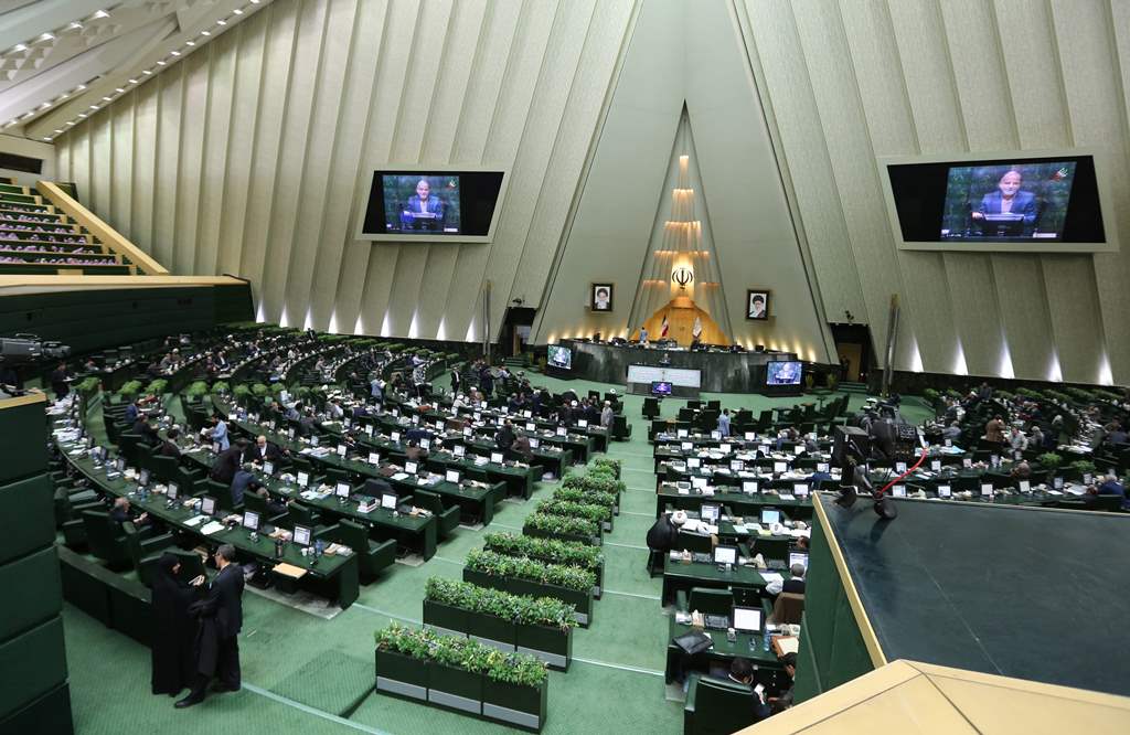 (FILES) This file photo taken on March 01, 2016 shows Iranian MPs attending a parliament session in Tehran on March 1, 2016. AFP / ATTA KENARE