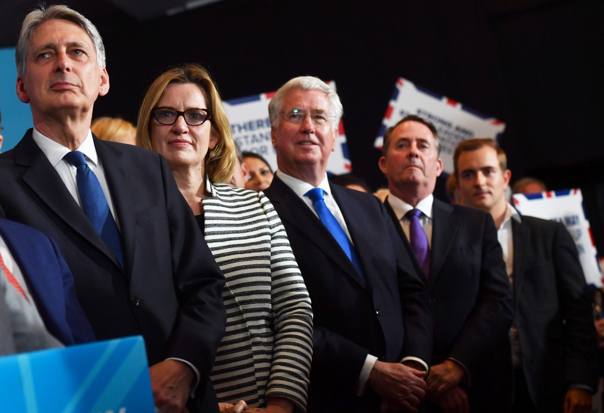 Britain's Chancellor of the Exchequer Philip Hammond (L), Britain's Home Secretary Amber Rudd (2nd L), Britain's Defence Secretary Michael Fallon (C) attend a general election campaign rally in Birmingham on June 7, 2017. AFP / Ben Stansall