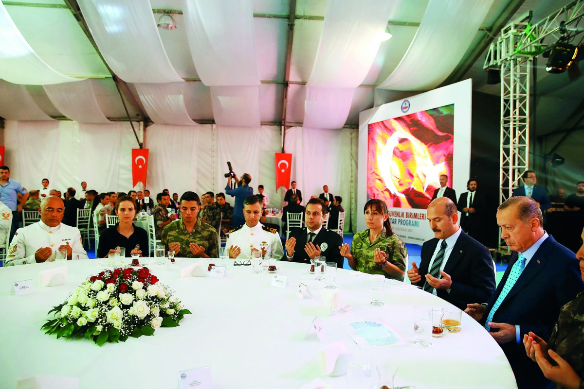 Turkish President Recep Tayyip Erdogan (right) and Turkish Minister of Interior, Suleyman Soylu (second right) attend an Iftar with Internal security units at the Police Special Operation Department's Headquarters in Golbasi district of Ankara, yesterday.