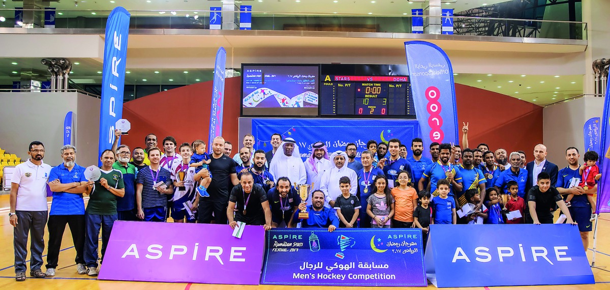 A group photo of the organisers and winners of the indoor hockey tournament.