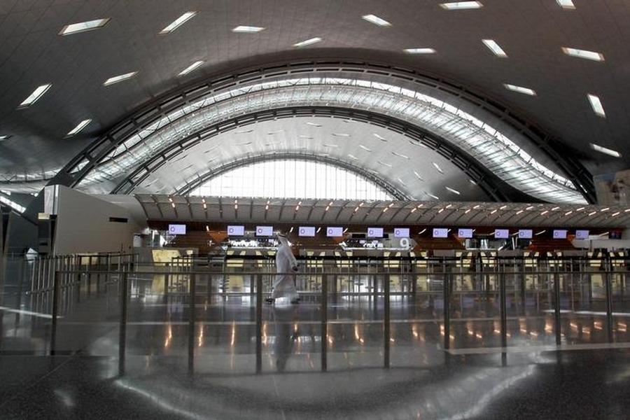 A Reuters file photo of a passenger walking in to the Hamad International Airport terminal.