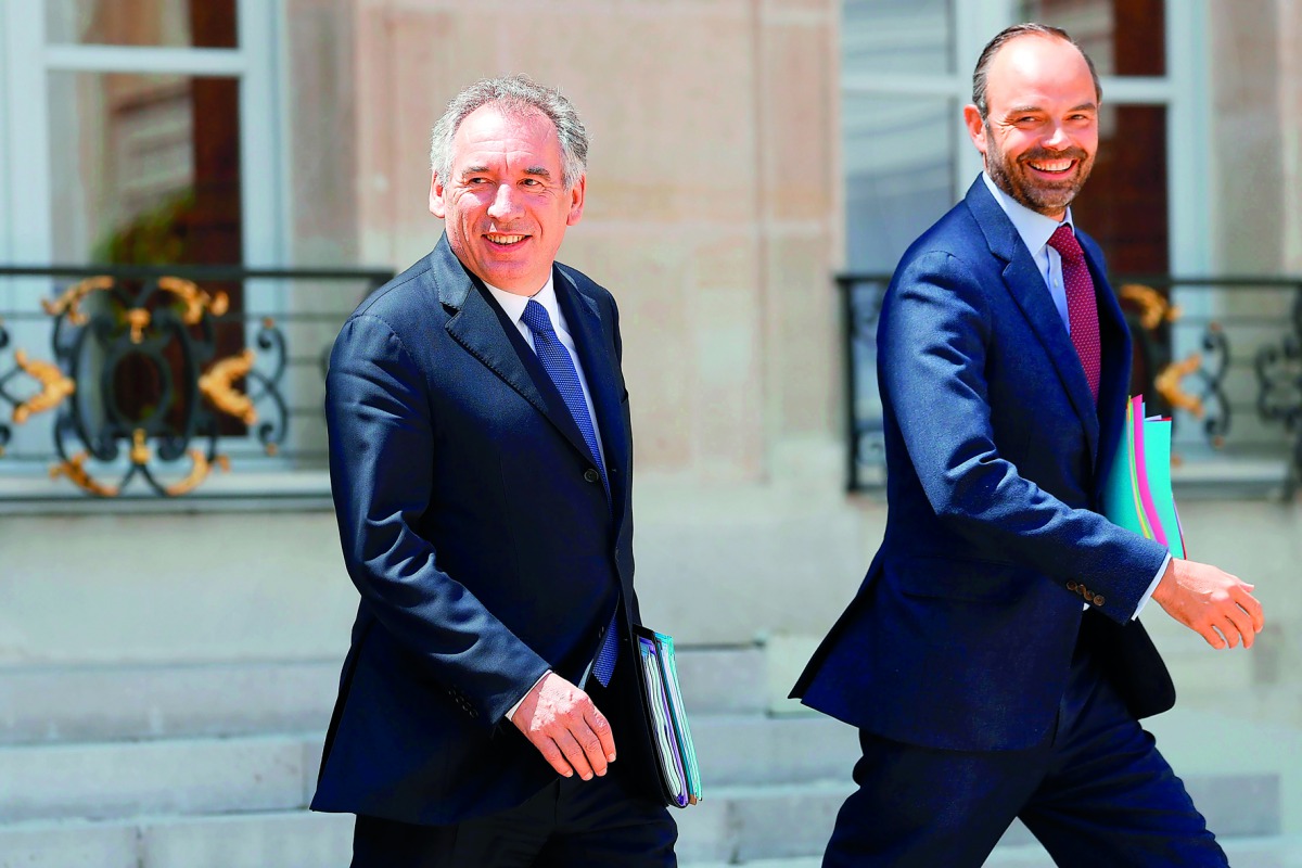 French Prime Minister Edouard Philippe (right) and French Minister of Justice Francois Bayrou leave a cabinet meeting at the Elysee Palace, in Paris, yesterday. 