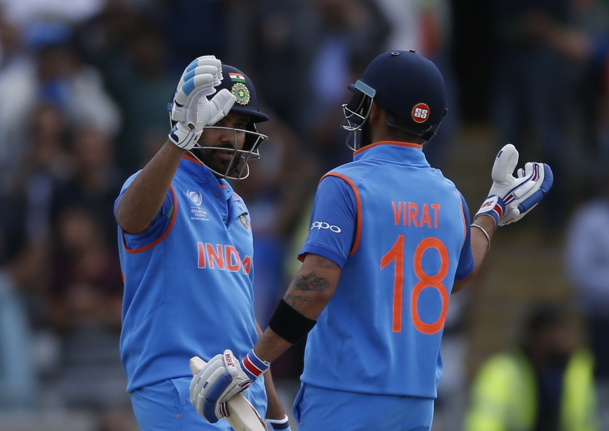 India's Rohit Sharma and Virat Kholi (right) celebrate winning the match.  (Reuters / Paul Childs Livepic)