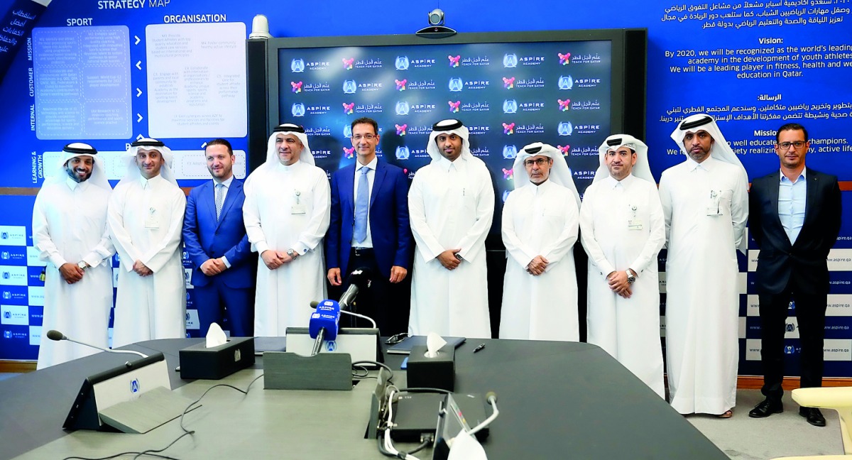 Officials of Aspire Academy and ‘Teach For Qatar’ (TFQ)  pose for a group picture. Pic: Hussein Sayed