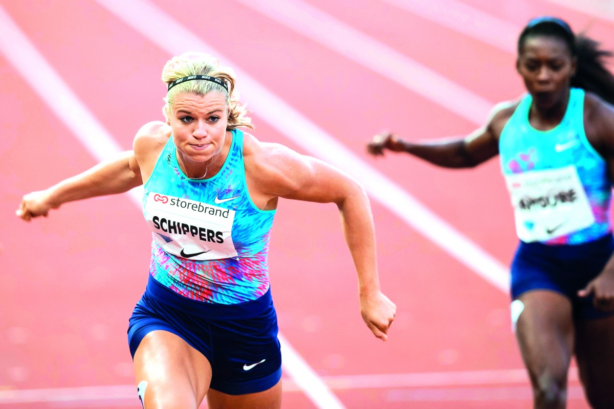 Netherlands' Dafne Schippers (left) crosses the finishing line ahead of Ivory Coast's Murielle Ahoure to win the women's 200m.