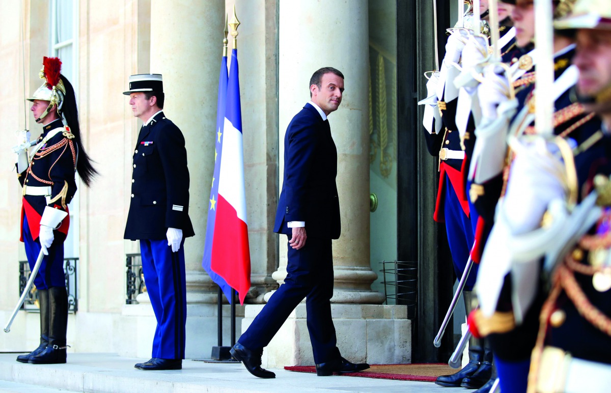 French President Emmanuel Macron stands on the steps of the Elysee Palace in Paris, France, June 16, 2017. REUTERS/Christian Hartmann