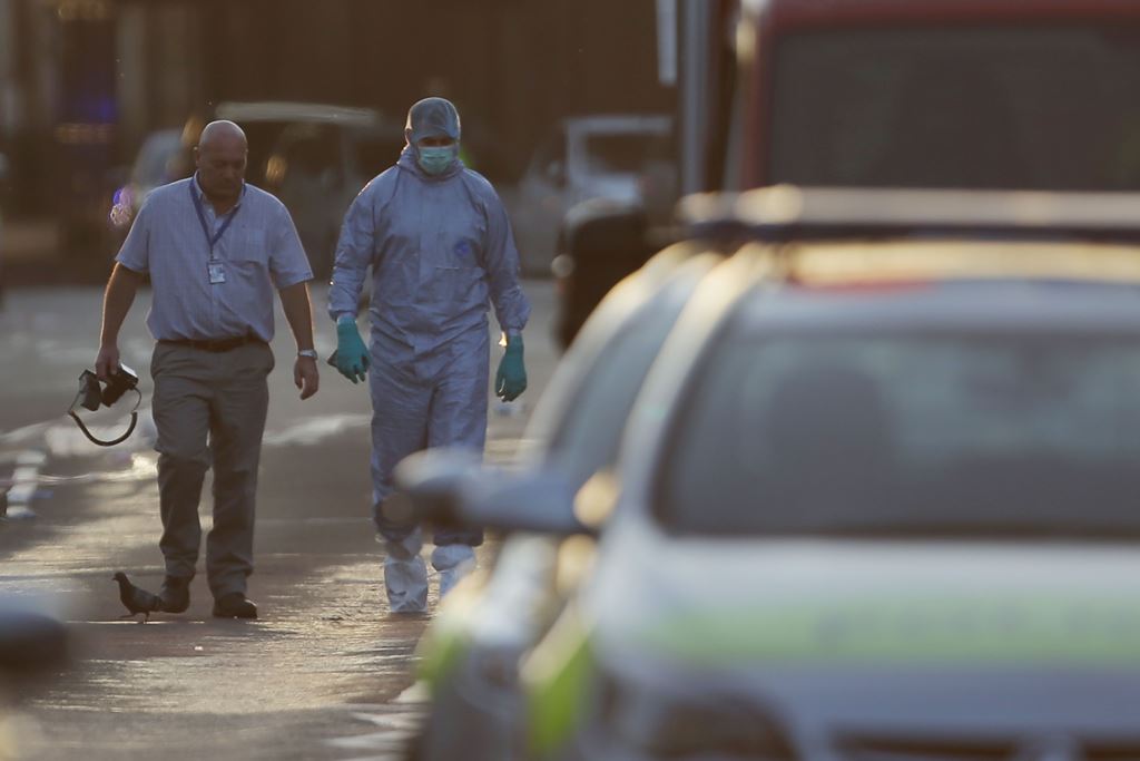 Forensic investigators work the scene in the Finsbury Park area of north London after a vehicle hit pedestrians, on June 19, 2017. AFP / Daniel LEAL-OLIVAS