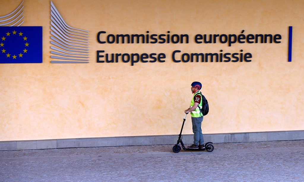 A scooter rider arrives at the EU headquarters as Britain and the EU launch Brexit talks in Brussels, June 19, 2017. REUTERS/Francois Lenoir
