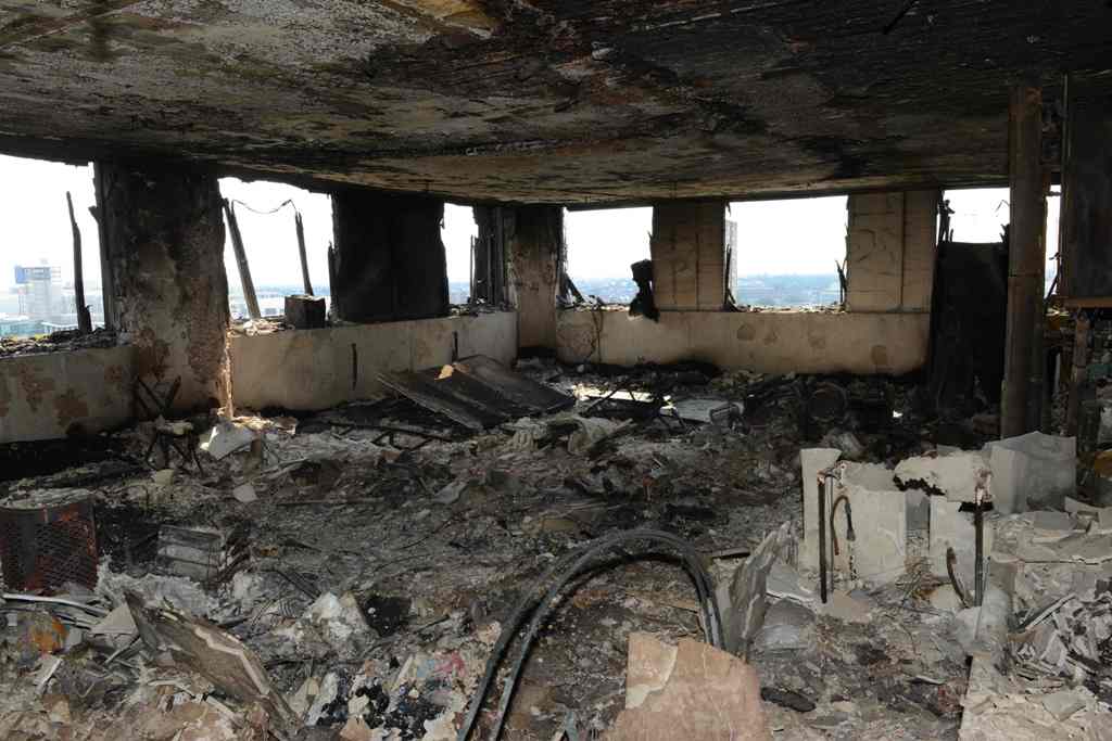 Handout picture released by the Metropolitan Police showing the inside of the Grenfell Tower in west London on June 16, 2017 after a fire engulfed the 24-storey building on Wednesday. / AFP.
