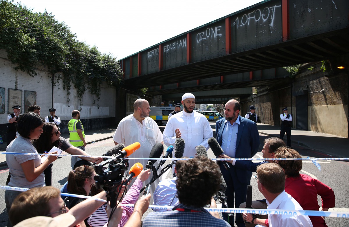 Mohammed Mahmoud (C), an Imam at Finsbury Park Mosque, gives a statement to the media at a police cordon in the Finsbury Park area of north London on June 19, 2017, following a vehicle attack on pedestrians. Ten people were injured when a van drove into a