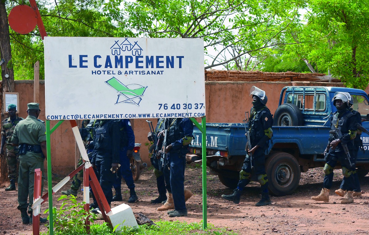 Soldiers of Malian security forces walk at the entrance of the Kangaba tourist resort following an attack in Dougourakoro, to the east of the capital Bamako, Mali, yesterday.
