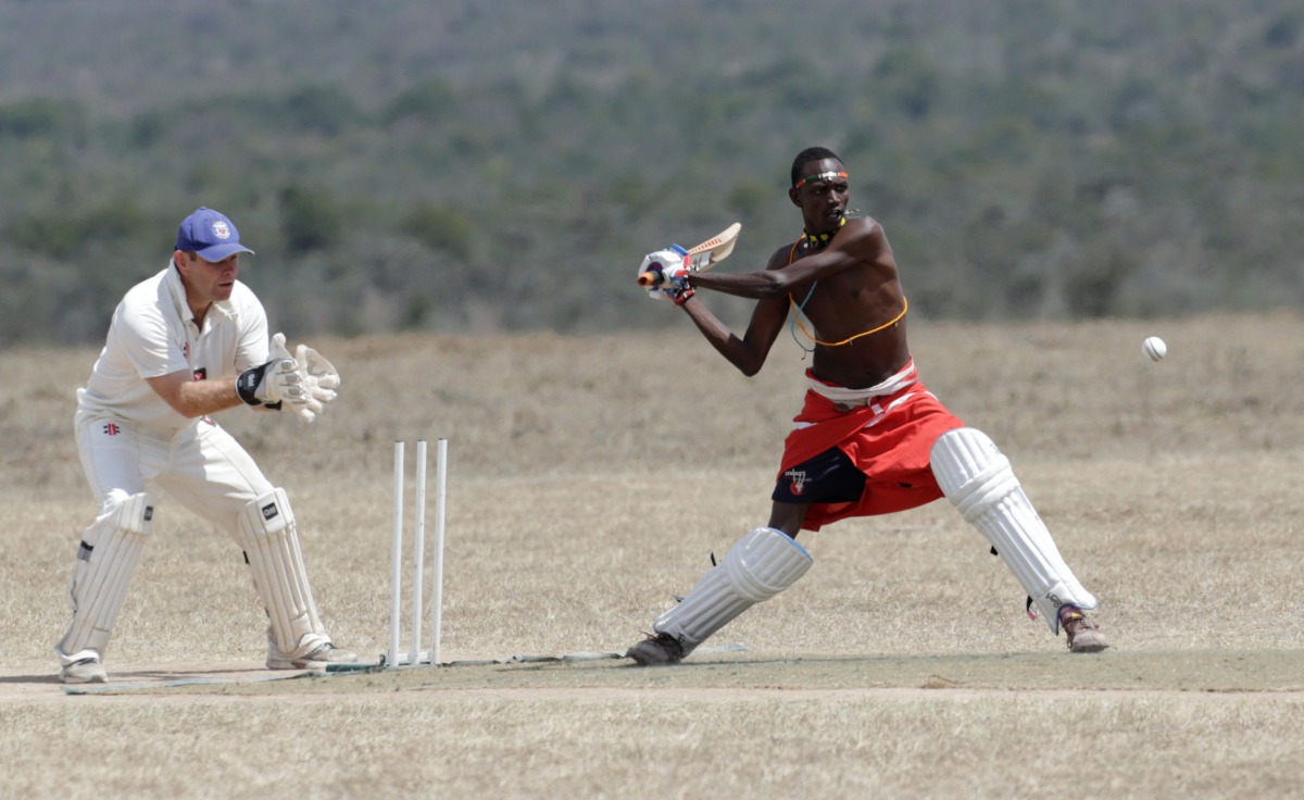 Daniel Mamai of the Maasai Cricket Warriors plays against the British Army Training Unit (BATUK) cricket team during a charity tournament called the 