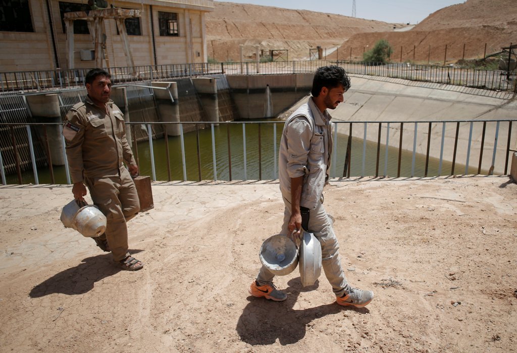 Members of Roj Mine Control Organization prepare explosive devices planted by Islamic State militants to be destroyed near Ain Issa village north of Raqqa, Syria, June 20, 2017. REUTERS/Goran Tomasevic
