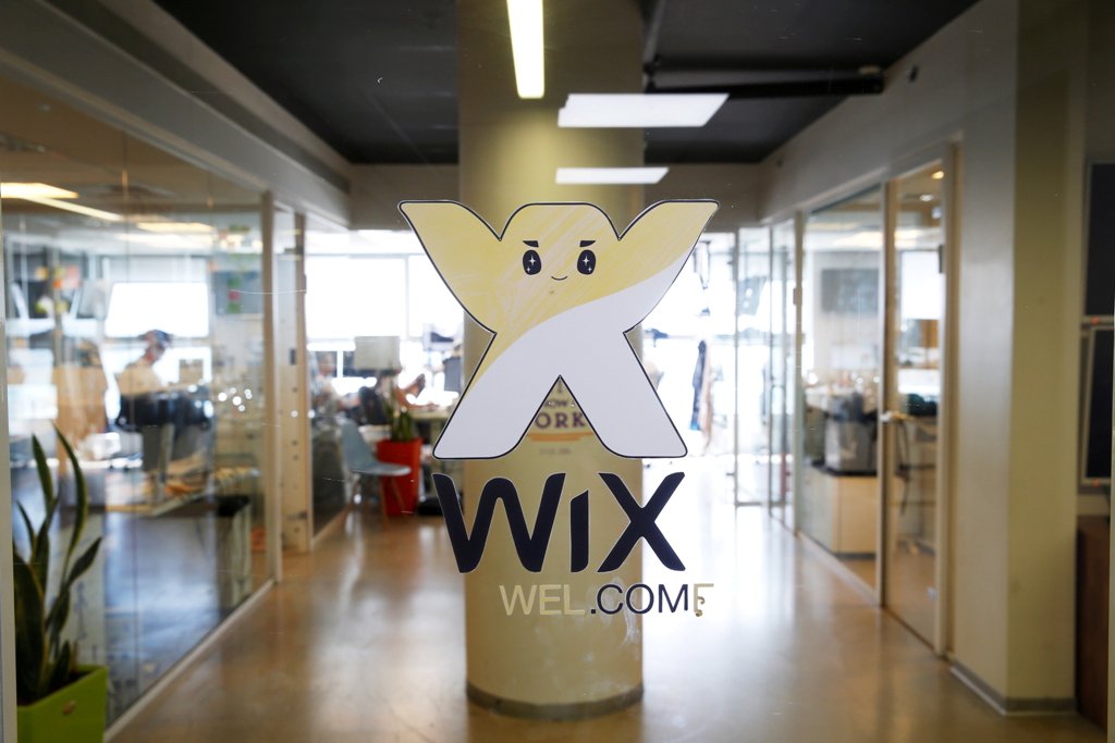 FILE PHOTO: Employees work at website-designer firm Wix.com offices in Tel Aviv, Israel July 4, 2016. REUTERS/Baz Ratner/File Photo
