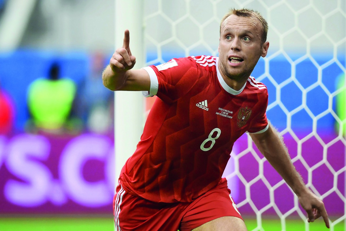 Russia's midfielder Denis Glushakov celebrates after scoring a goal against New Zealand in their Confederations Cup match at the Krestovsky Stadium in Saint-Petersburg,  in this June 18 file picture.