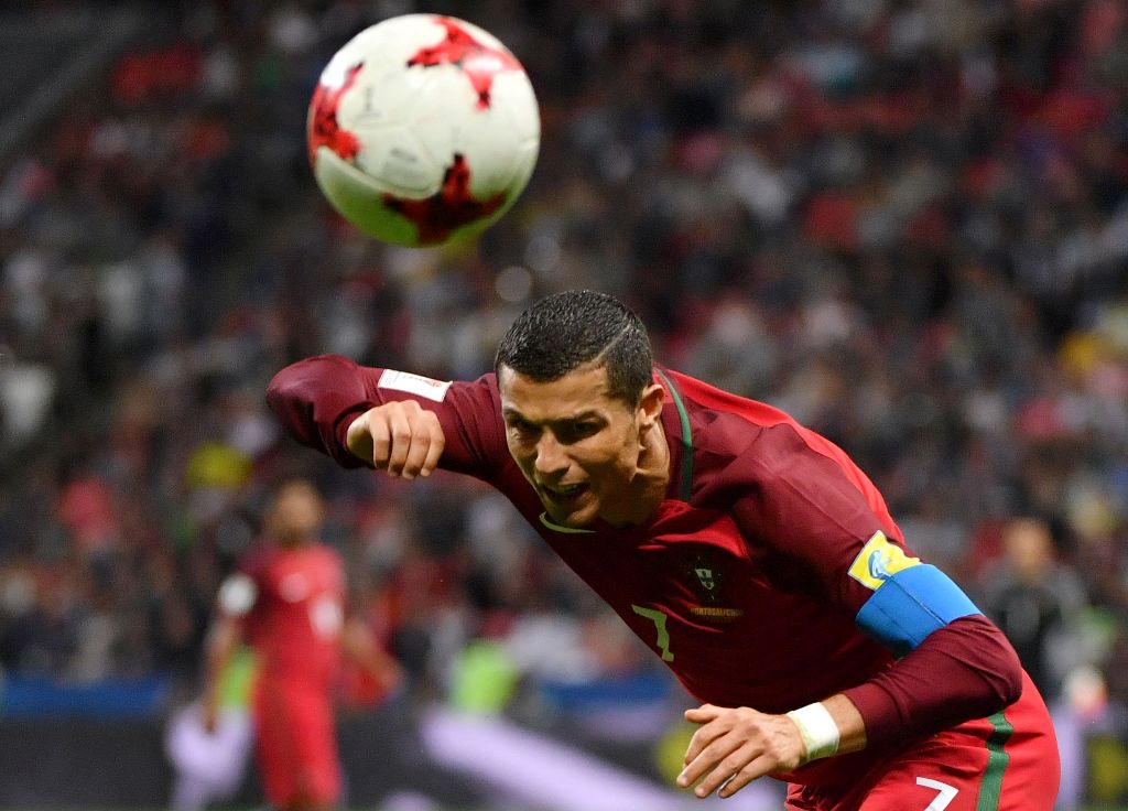 Portugal's forward Cristiano Ronaldo heads the ball during the 2017 Confederations Cup semi-final football match between Portugal and Chile at the Kazan Arena in Kazan on June 28, 2017. AFP / Yuri CORTEZ