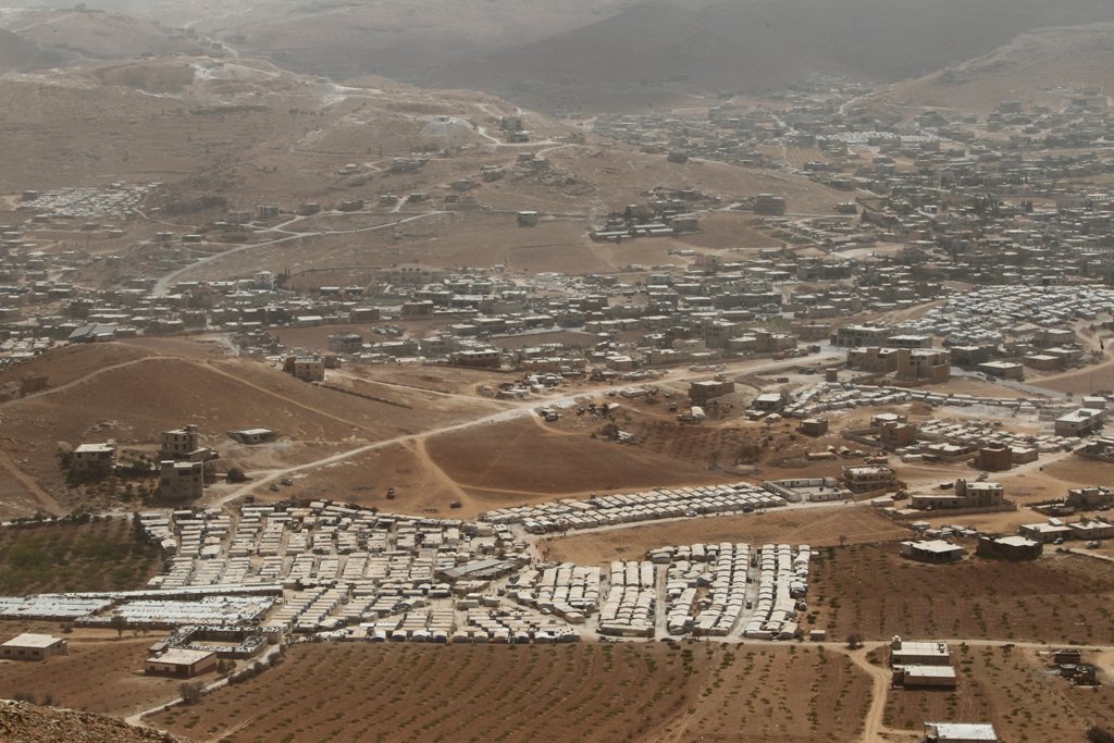 FILE PHOTO: A general view shows Syrian refugee camps dotted in and around the Lebanese town of Arsal, near the border with Syria, Lebanon September 21, 2016. REUTERS/Mohamed Azakir/File Photo
