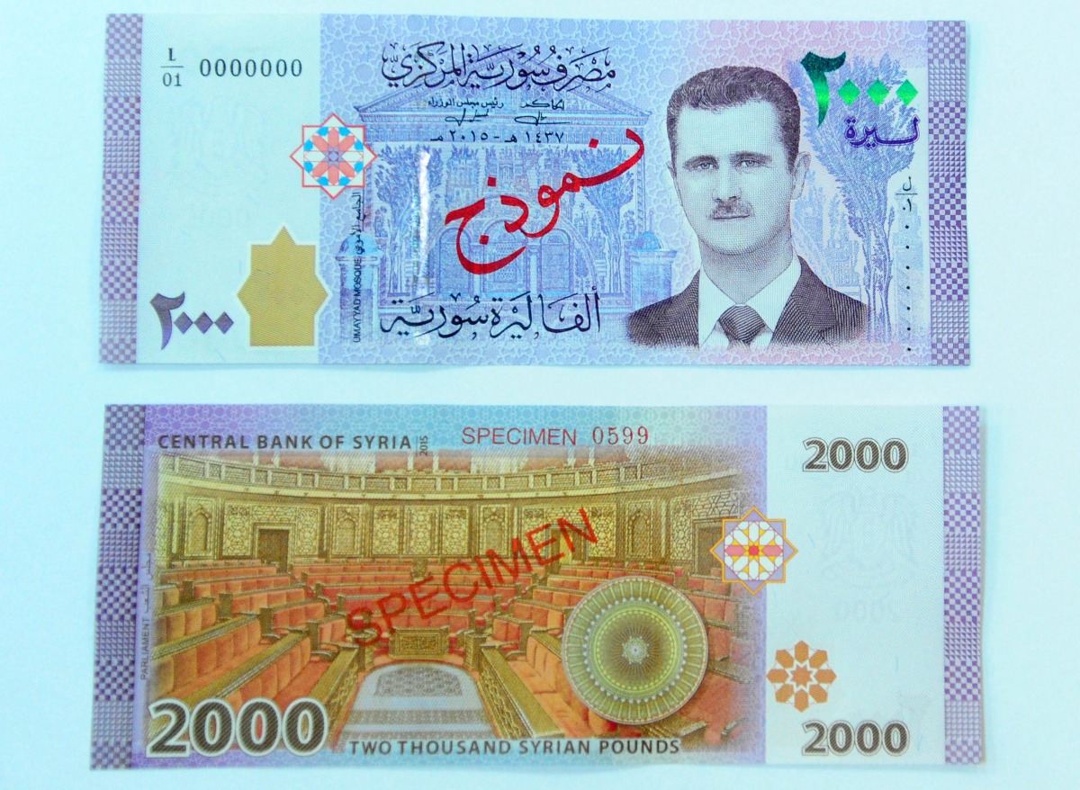 A portrait of Syria's President Bashar al-Assad is seen printed on the new Syrian 2,000-pound banknote that went into circulation on Sunday, in this handout picture provided by SANA on July 2, 2017, Syria.