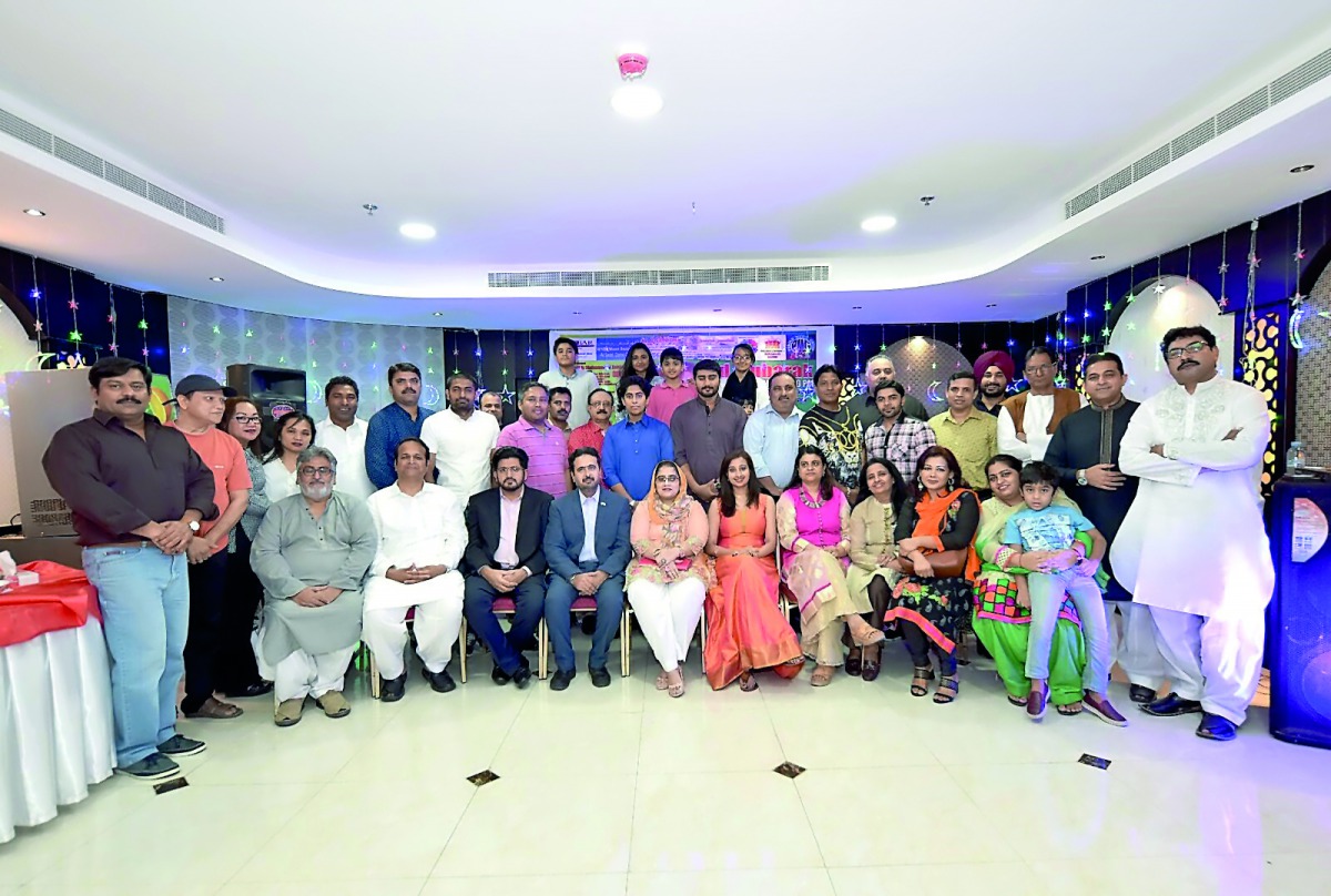 Officers and members of PMG Doha with local singers and musicians during the Eid Al Fitr party organised by PMG Doha. 