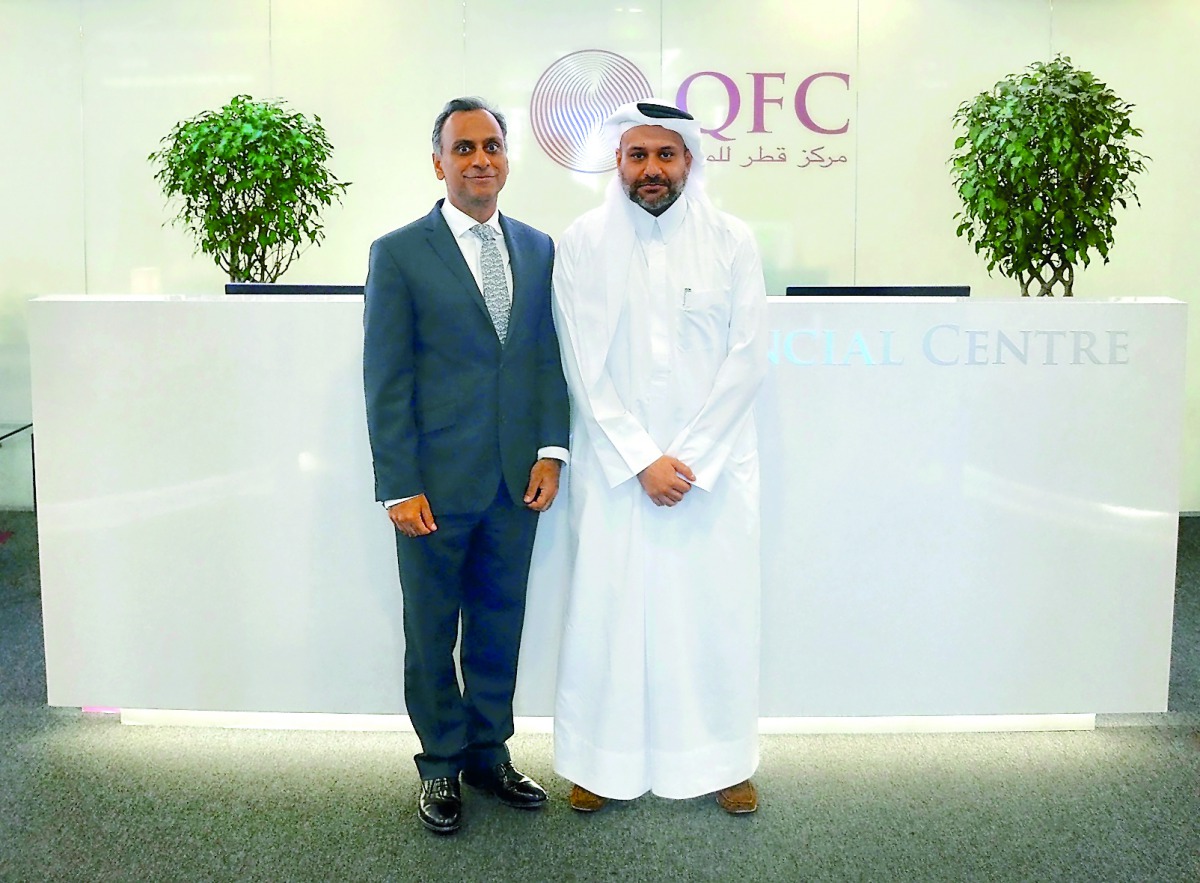 Yousuf Mohamed Al Jaida, Qatar Financial Centre Chief Executive Officer, and UK's Ambassador to Qatar, Ajay Sharma. at QFC headquarters. 