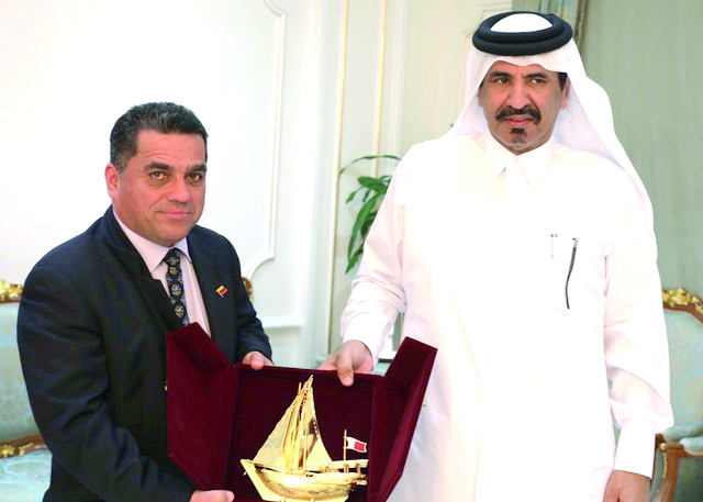 Mohamed bin Ahmed bin Tawar Al Kuwari (right), Vice-Chairman, QC, honouring Venezuelan minister, Douglas Sosa.