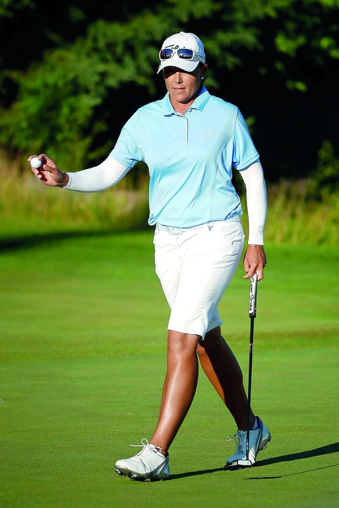 Katherine Kirk of Australia waves to the crowd following a birdie on the 15th green during the third round of the Thornberry Creek LPGA Classic at Thornberry Creek at Oneida in Oneida, Wisconsin, yesterday.