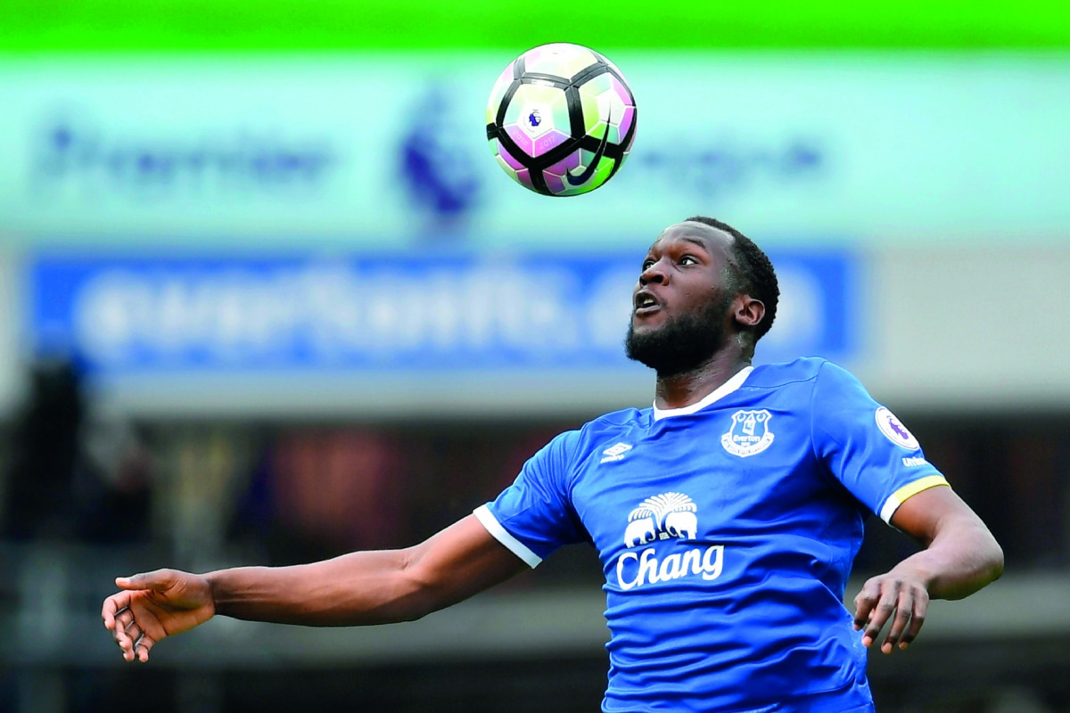 Everton's Belgian striker Romelu Lukaku heading the ball during an English Premier League football match against Chelsea at Goodison Park in Liverpool in this file photo. Romelu Lukaku officially completed his move from Everton to Manchester United yester