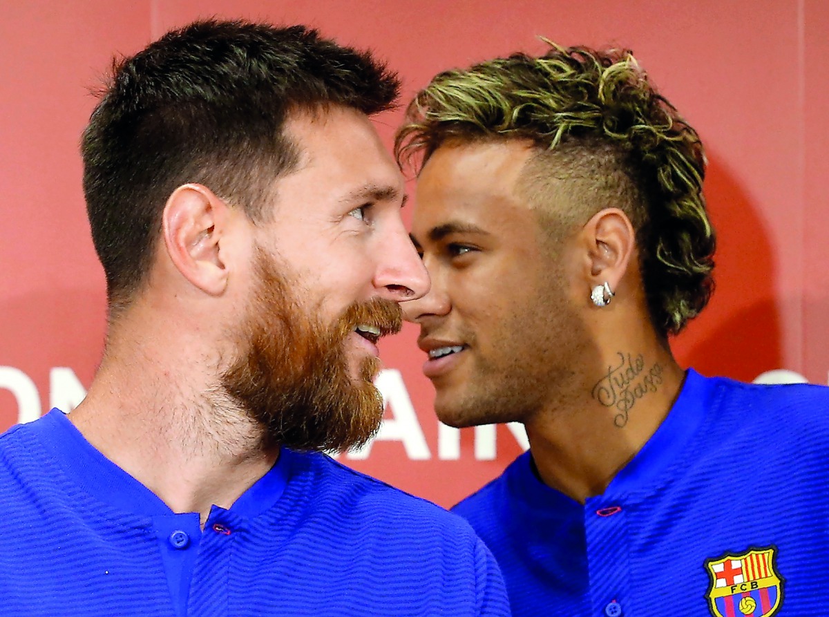 FC Barcelona players Lionel Messi and Neymar attend a news conference to announce the sponsorship deal between the team and Rakuten Inc. in Tokyo, Japan.