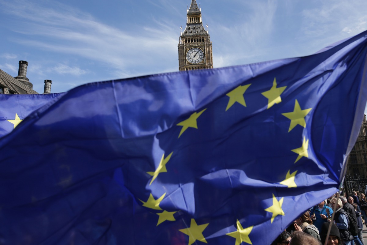 Demonstrators hold EU flags. (File photo / AFP / Daniel LEAL-OLIVAS)