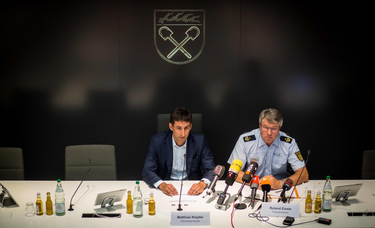 Matthias Klopfer (L), mayor of the southwestern German village of Schorndorf, and Aalen's police president Roland Eisele give a press conference on July 17, 2017 at the city hall of Schorndorf to comment on disturbances at a local festival during the past