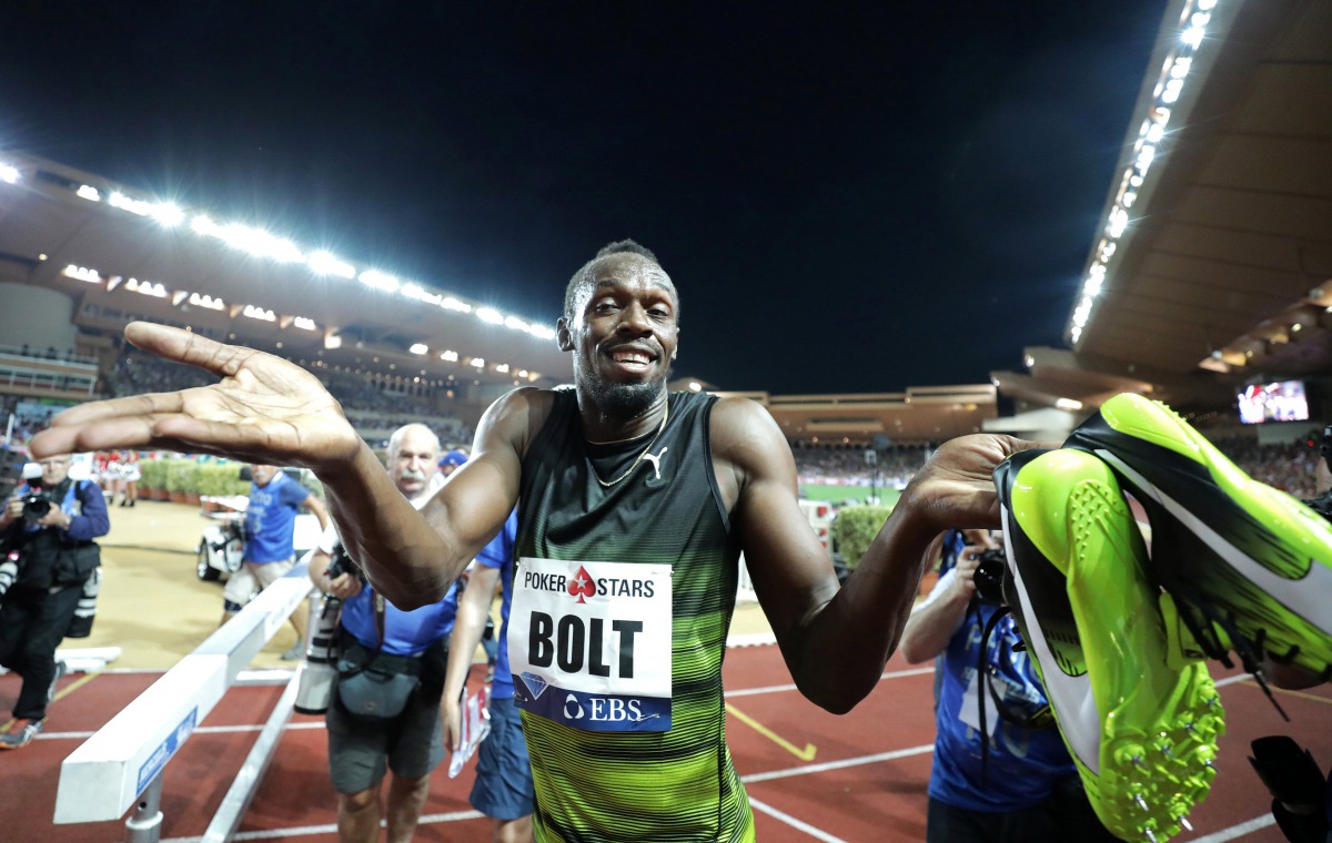 Jamaican sprinter Usain Bolt reacts after winning. REUTERS/Eric Gaillard
