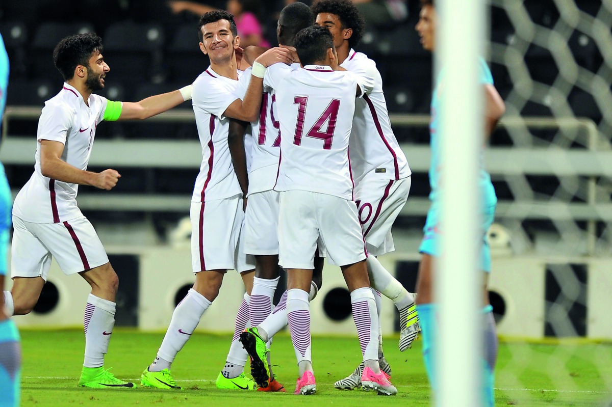 Qatari players celebrate after scoring their wining goal during the AFC U-23 Championship qualifying match against India at Al Sadd Stadium on Friday. Qatar coach Felix Sanchez reacts during a training session in this file photo.