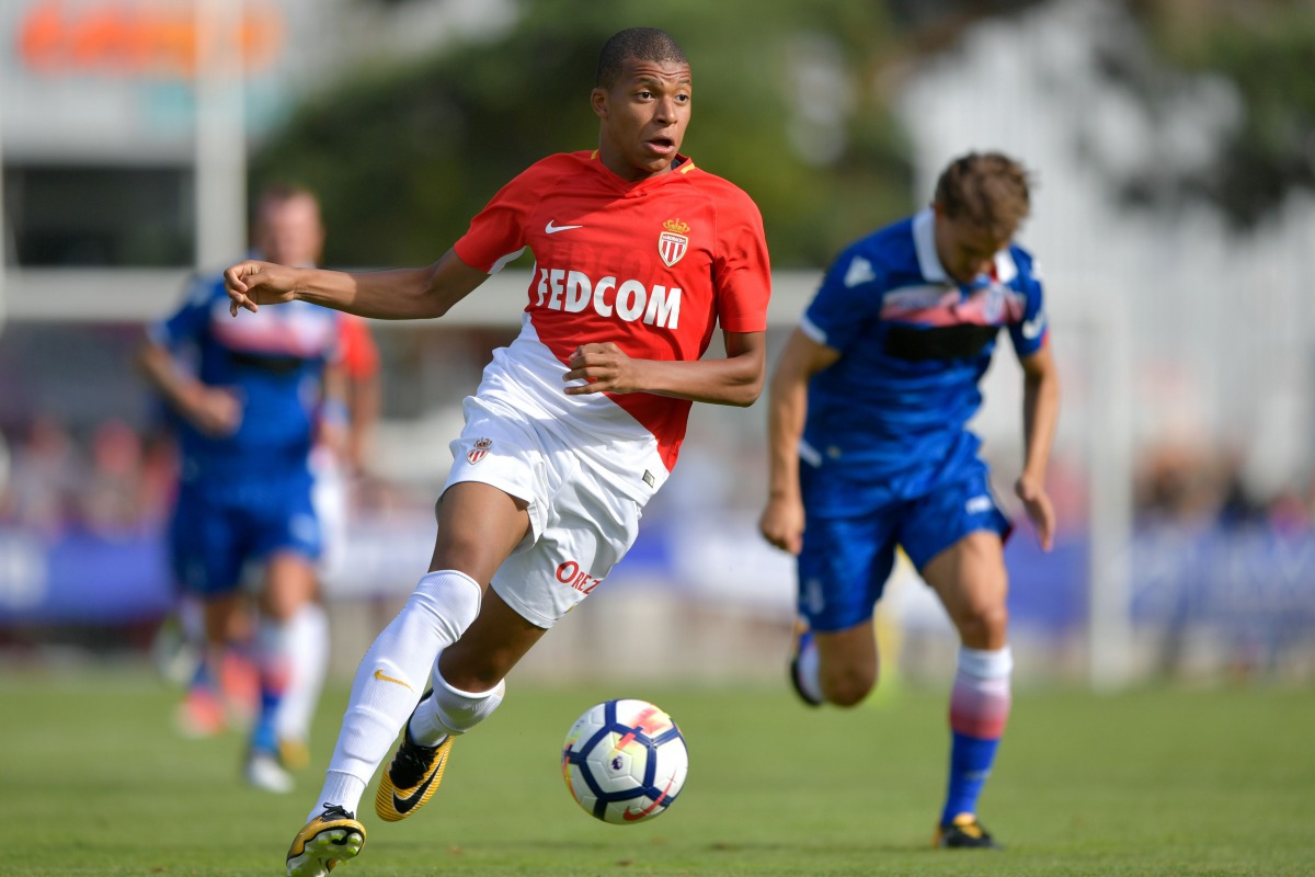 This file photo taken on July 15, 2017 shows Monaco’s forward Kylian Mbappe controling the balll during a friendly football match between AS Monaco and Stoke City FC in Martigny.