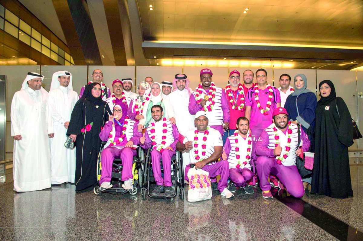 The Qatari delegation for the 2017 World Para Athletics Championships pose for a photograph with Secretary General of the Qatar Olympic Committee (QOC) Dr Thani bin Abdulrahman Al Kuwari upon their arrival at the Hamad International Airport on Monday. Qat