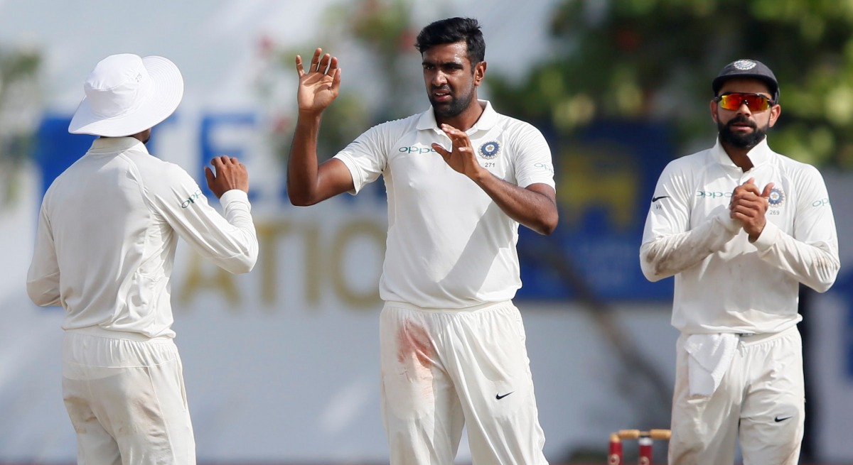 India's Ravichandran Ashwin celebrates with teammates after taking the wicket of Sri Lanka's Niroshan Dickwella (not pictured). REUTERS/Dinuka Liyanawatte