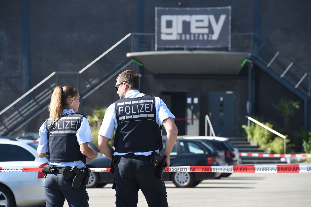 Police stand in front of the disco Club Grey in the southern German town of Konstanz, where a gunman opened fire, killing one and wounding four people before being shot by police, on July 30, 2017. ( AFP / dpa / Felix K?stle)