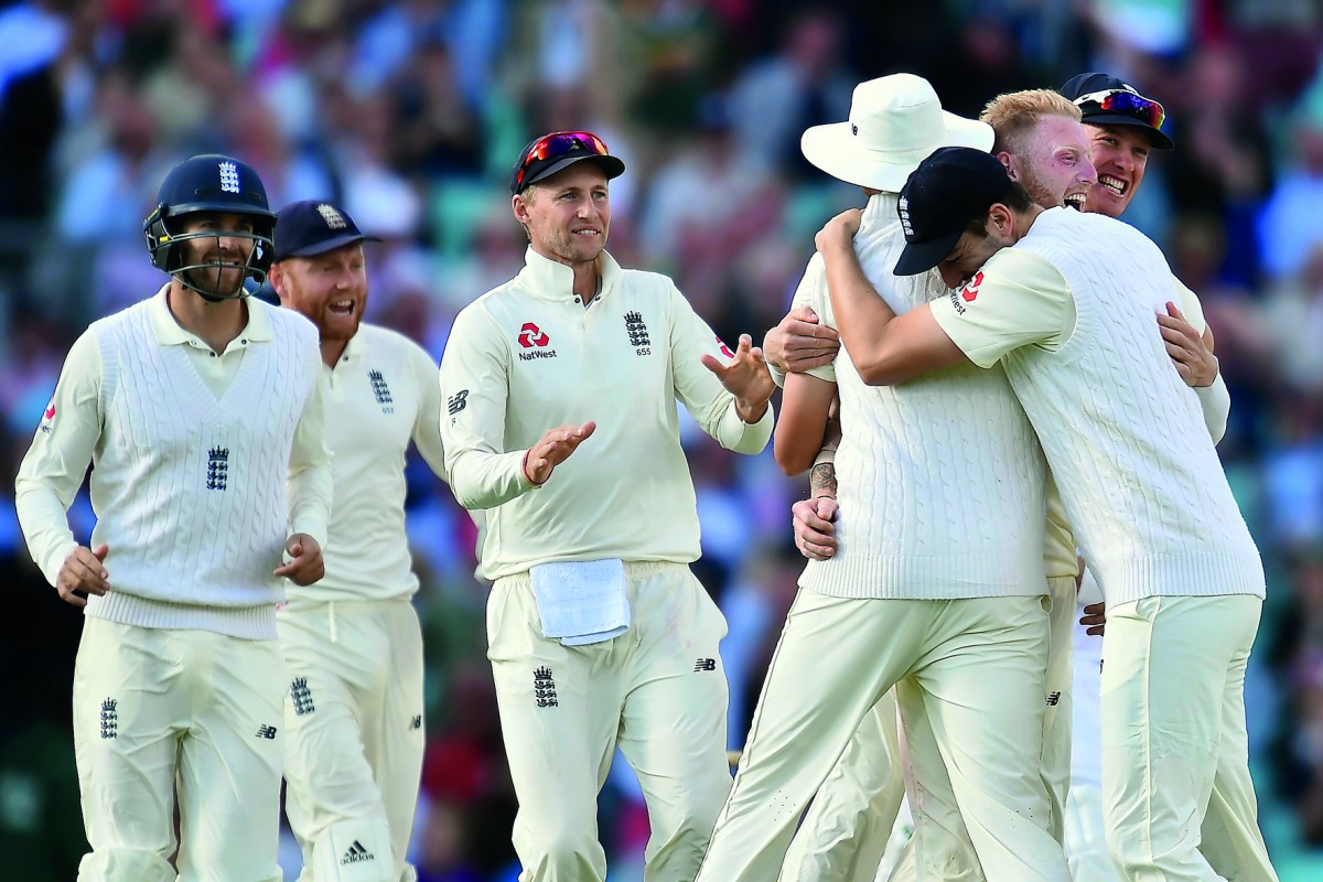 England’s Ben Stokes (second right) celebrates with team-mates after trapping South Africa’s captain Faf du Plessis on day 4 of their third Test at the Oval in London, yesterday. 