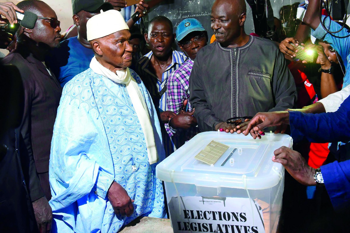 Former Senegal’s president and candidate for the legislative elections Abdoulaye Wade prepares to cast his ballot in Dakar, yesterday.