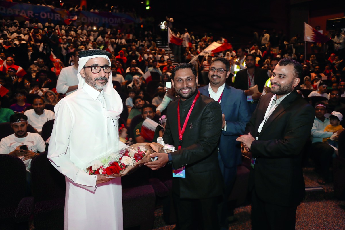 Minister of Culture and Sports H E Sheikh Salah bin Ghanim Al Ali being honoured by representatives of the Indian community in Qatar. RIGHT: Audience at the event organised by the Indian community at Qatar National Theatre.