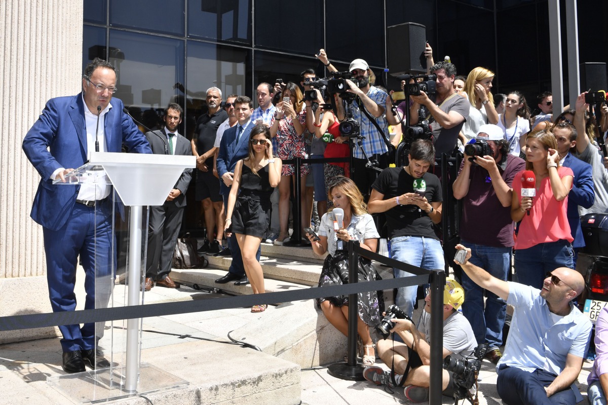 A member of Real Madrid's Portuguese forward Cristiano Ronaldo communication team speaks to the media after Ronaldo appeared before a court in Pozuelo de Alarcon, a wealthy suburb of Madrid, on July 31, 2017 to answer on four counts of tax evasion of 14.7