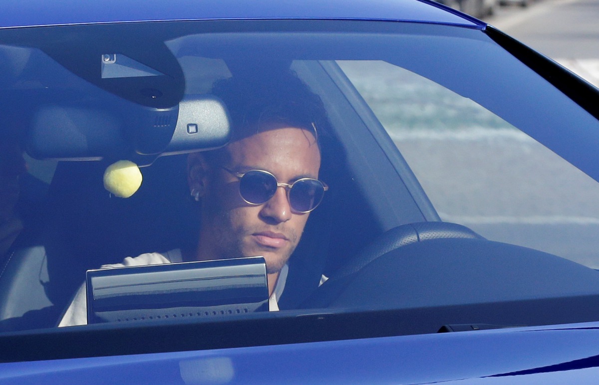 Brazilian soccer player Neymar drives to arrive to Joan Gamper training camp near Barcelona, Spain, August 2, 2017. (REUTERS)