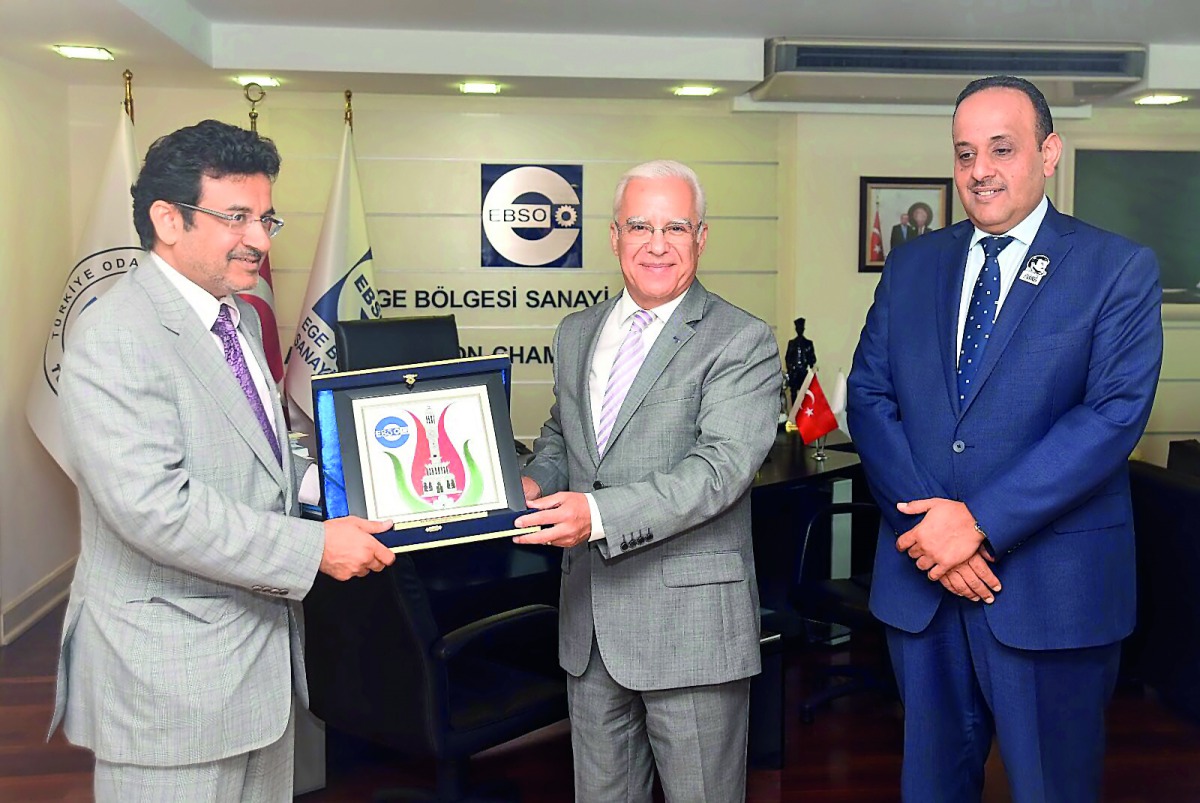 Mohammed Mehdi Al Ahbabi (left), presenting a memento to Turkish officials in Izmir, Turkey.