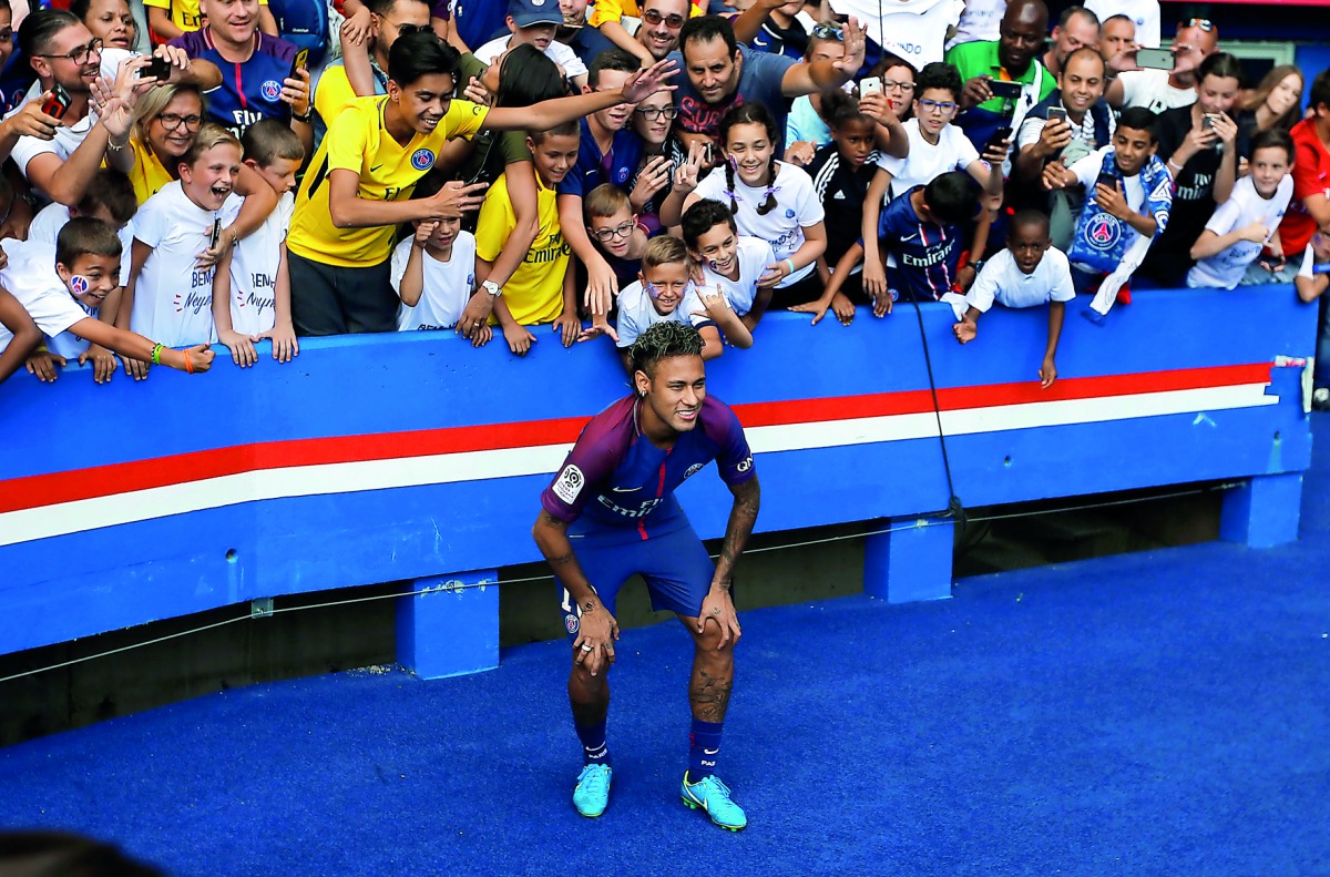 Neymar poses for a photograph with the fans.