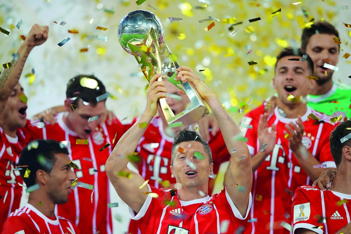 Bayern Munich’s players celebrates with the trophy after winning the Supercup final.