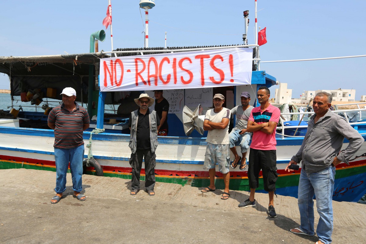 Tunisian fishermen gather on August 6, 2017 in the port of Zarzis in southeastern Tunisia to protest against a possible berthing of the C-Star vessel, hired by far-right activists from a group which calls itself 