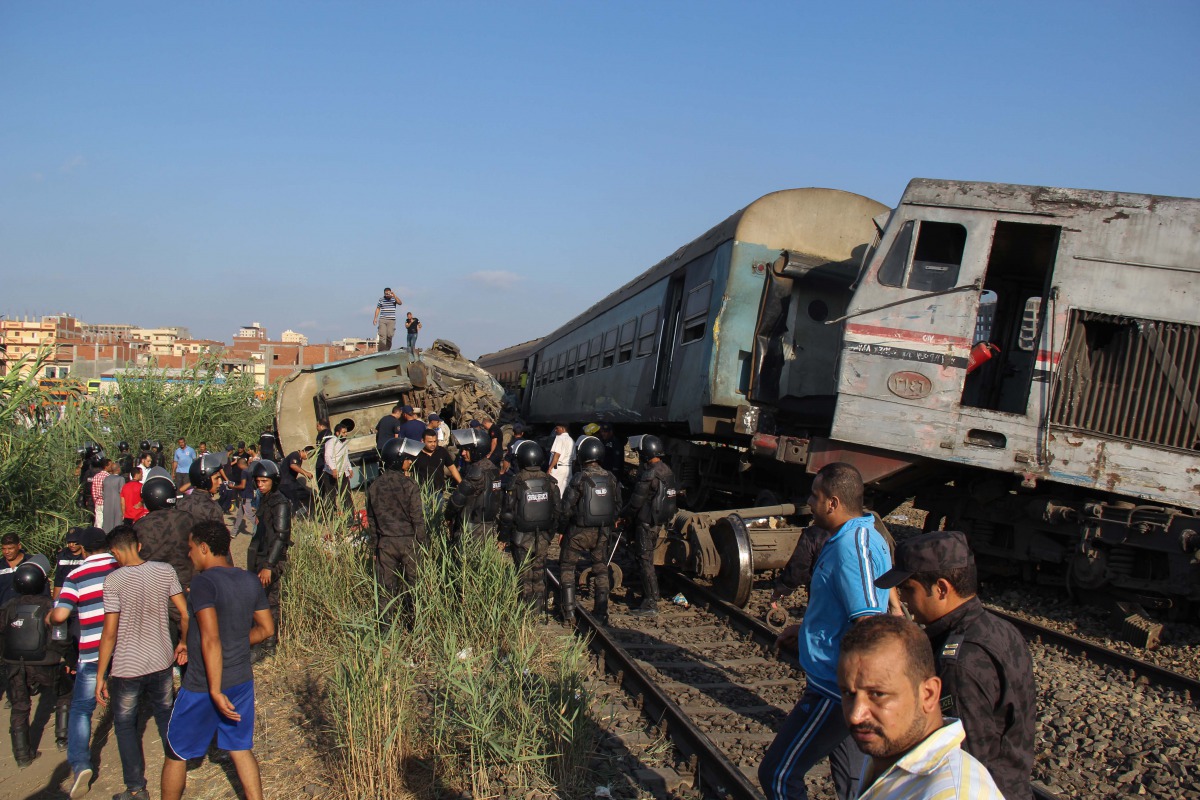 Security forces inspect the site after two trains collided in Khorshid district of Alexandria, Egypt on August 11, 2017. (Ahmed Abd Alkawey - Anadolu Agency)
