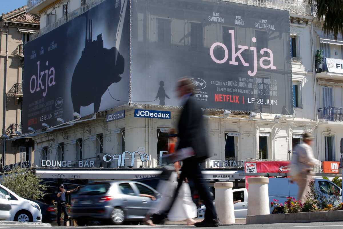 A poster for the Netflix movie Okja in competition at the Cannes Film Festival is displayed on the Croisette (REUTERS / Stephane Mahe) 