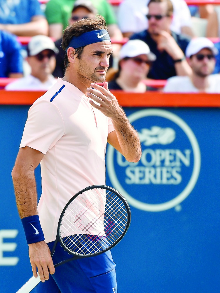 Roger Federer of Switzerland looks on against Roberto Bautista Agut of Spain during day eight of the Rogers Cup at Uniprix Stadium on Saturday in Montreal, Quebec, Canada.