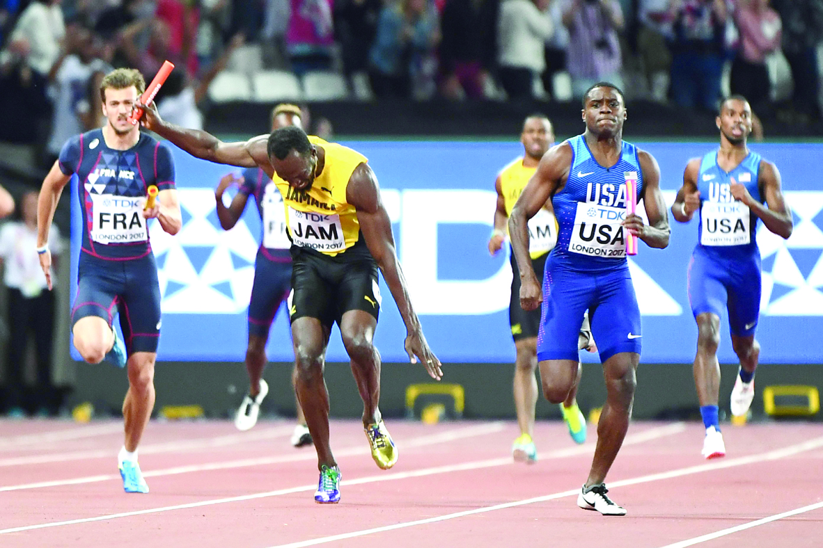 Usain Bolt (centre) falls on Jamaica’s anchor leg of the men’s 4x100m relay final at the 2017 IAAF World Championships in London  yesterday.