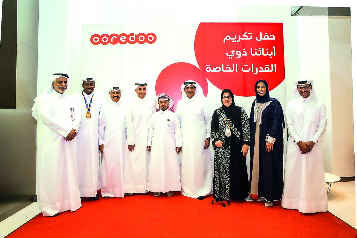 Ooredoo Chairman Sheikh Abdulla bin Mohammed Al Thani and other officials with athletes at the event.